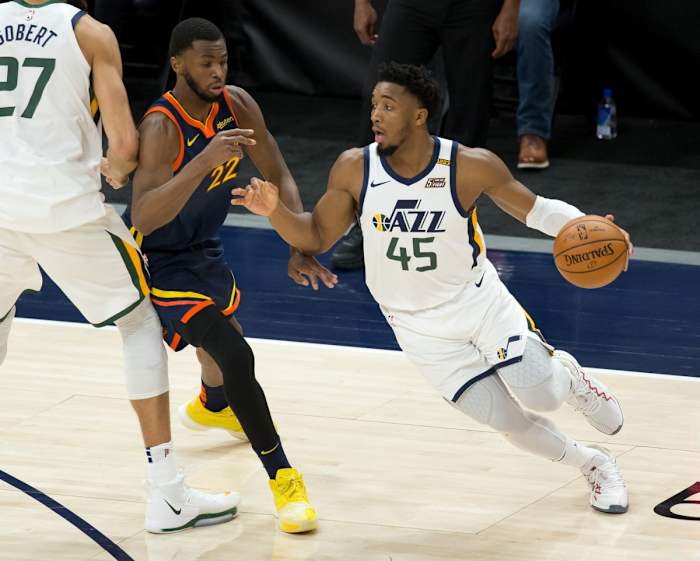 Donovan Mitchell (45) looks for an open lane against the Golden State Warriors
